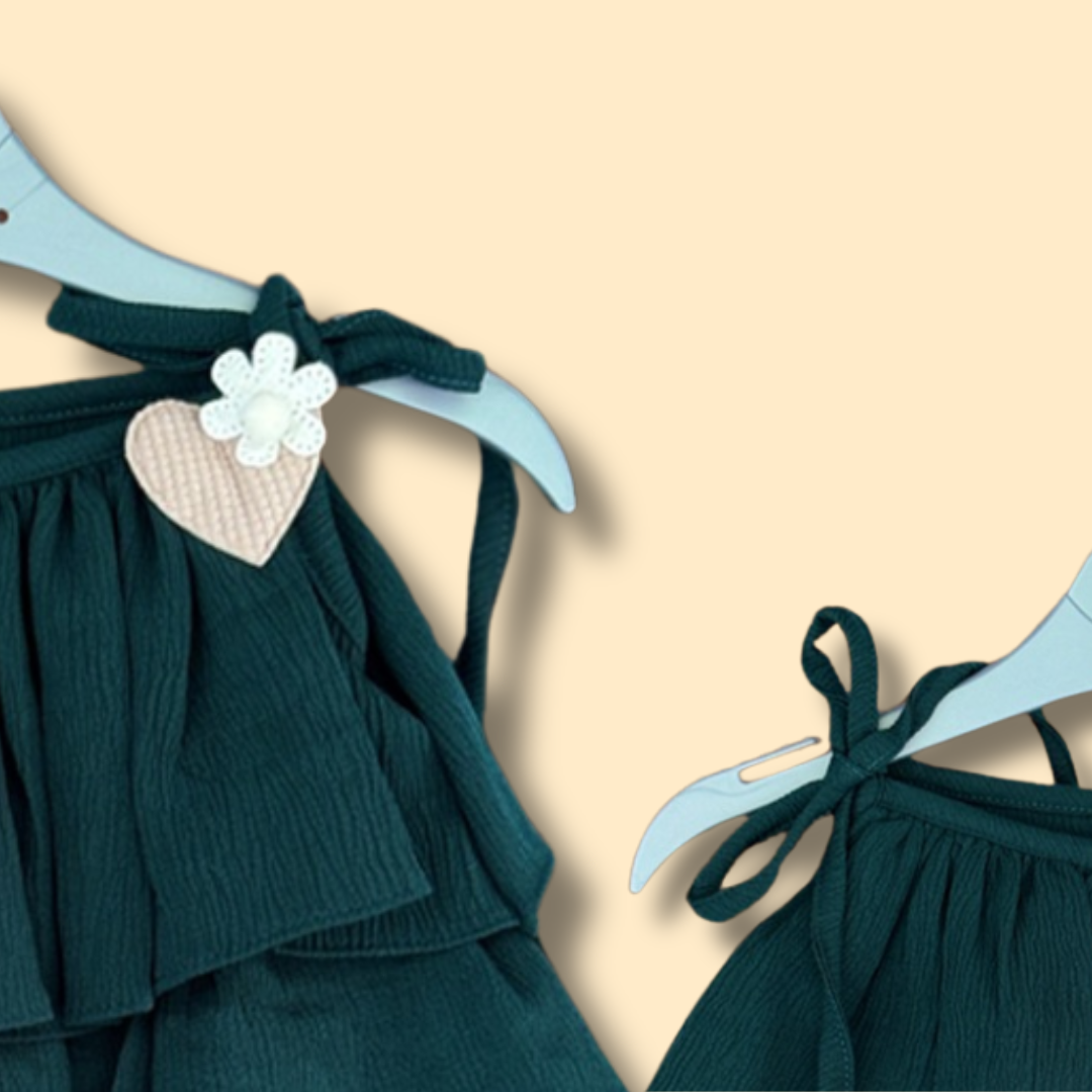 green tiered ruffle dress with shoulder tie straps and cute heart detail