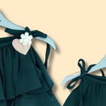 green tiered ruffle dress with shoulder tie straps and cute heart detail