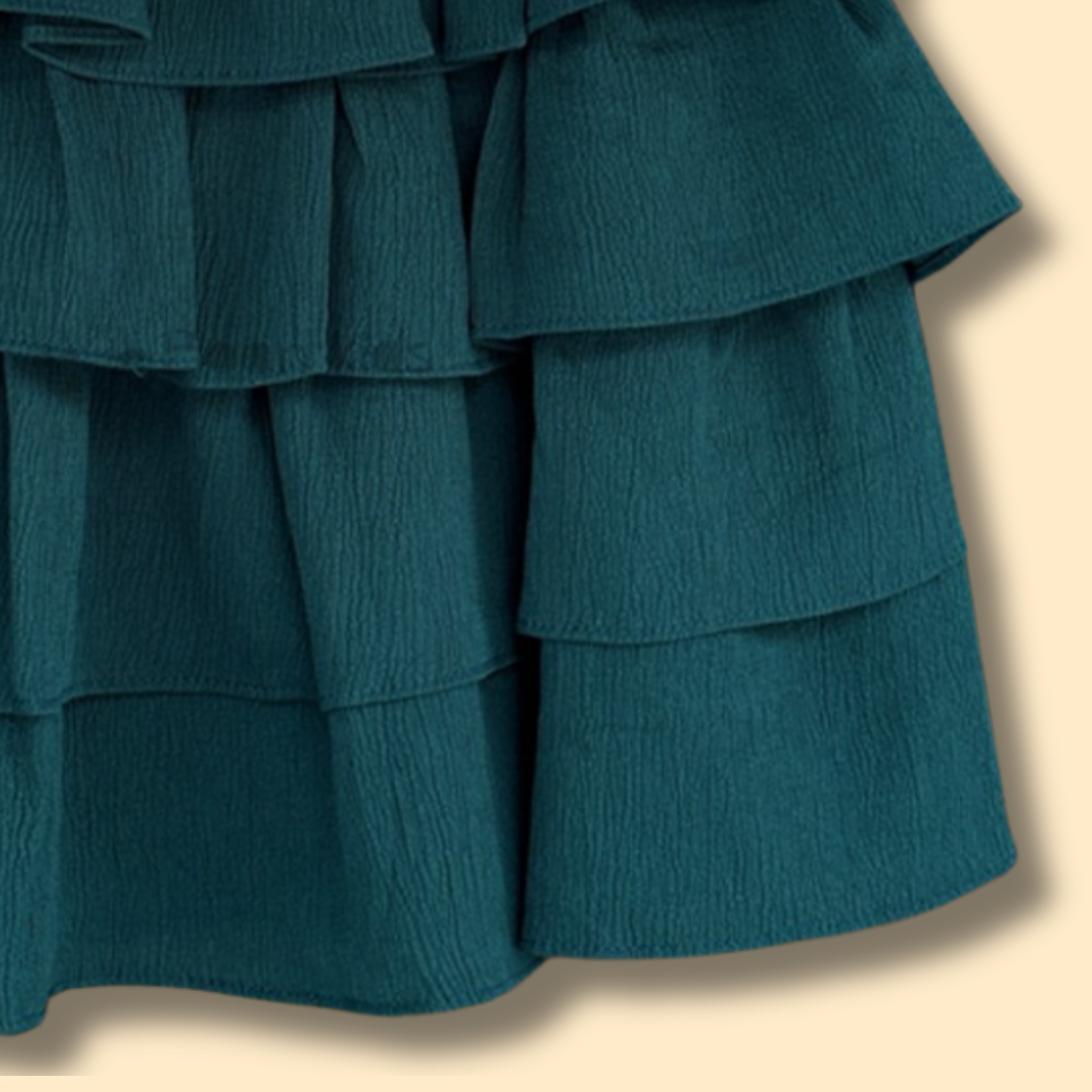 green tiered ruffle dress with shoulder tie straps and cute heart detail
