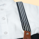boys white button-up shirt with black shorts and striped suspenders set