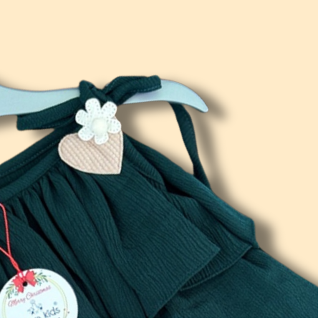 green tiered ruffle dress with shoulder tie straps and cute heart detail