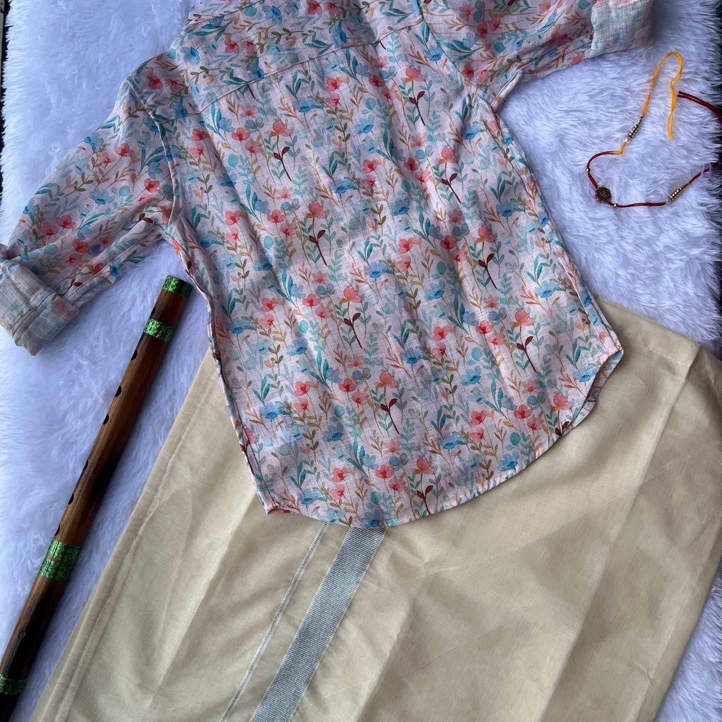 Floral-patterned shirt on a beige dhothi background