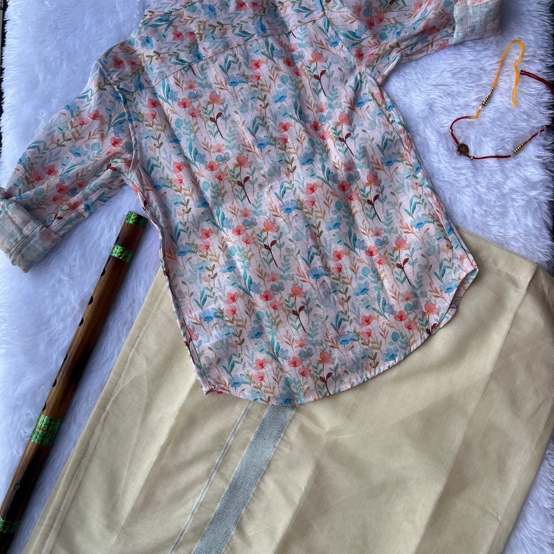 Floral-patterned shirt on a beige dhothi background