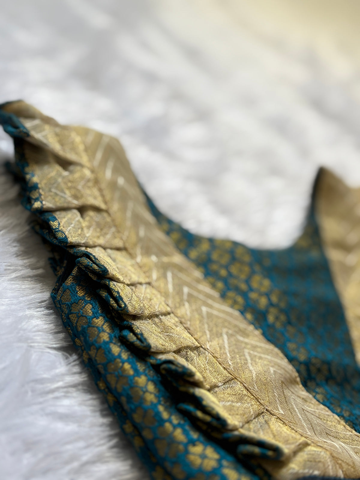 Close-up of a fabric with intricate patterns on a white background