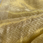 Close-up of gold fabric with zigzag pattern